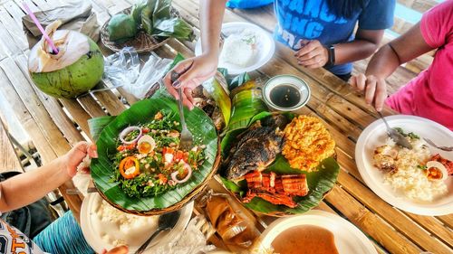 High angle view of people preparing food