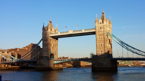 Tower bridge over thames river against clear sky