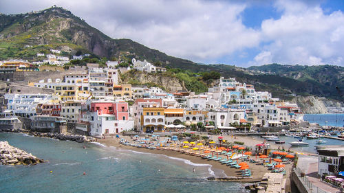 Panoramic shot of townscape by sea against sky