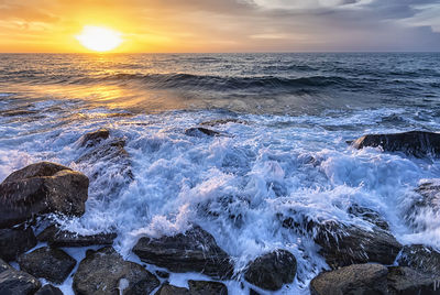 Scenic view of sea against sky during sunset