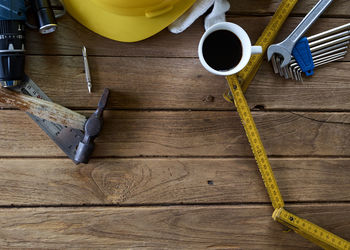 Close-up of coffee with various work tools on table