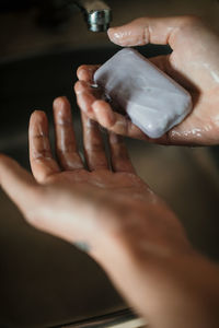 Close-up of woman holding hands