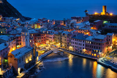 Illuminated buildings in city at night