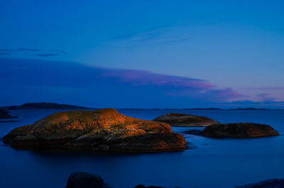 Golden rock in the sea just after sunset