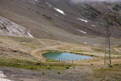 Scenic view of landscape by lake