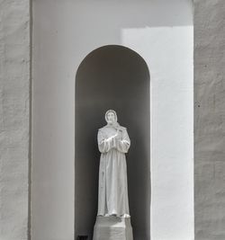 Statue against wall