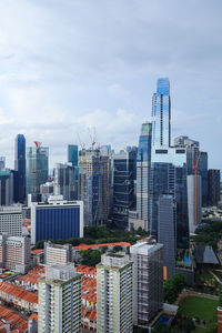 Modern buildings in city against sky