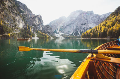 Scenic view of lake and mountains seen through boat