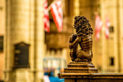 Close-up of statue against building