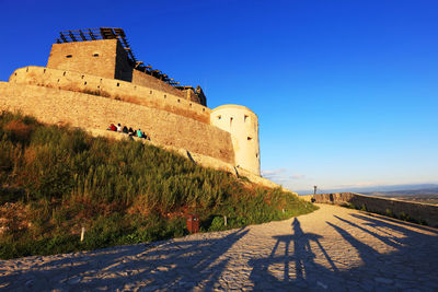 View of fort against blue sky