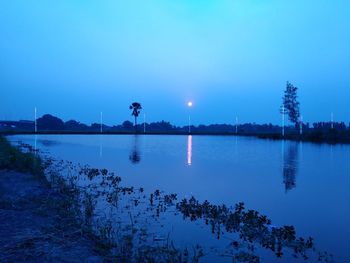 Scenic view of lake against blue sky