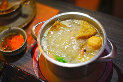 High angle view of soup in utensil on electric stove in kitchen