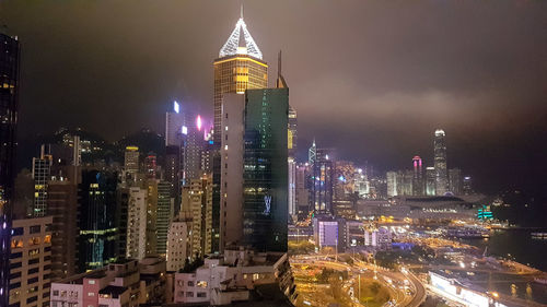 Aerial view of city lit up at night