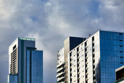 Low angle view of modern buildings against sky