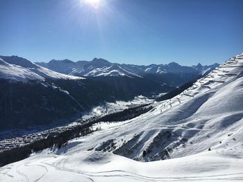 Scenic view of snow covered mountains against sky