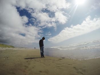 Silhouette of man standing on beach