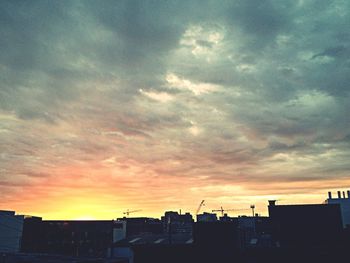 Dramatic sky over city at sunset