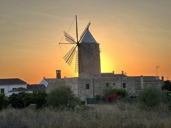 Low angle view of historic building against sky during sunset