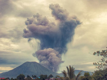 Scenic view of mountains against cloudy sky