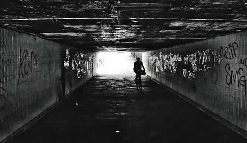 Rear view of a woman in tunnel