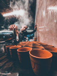 Man preparing food at market stall