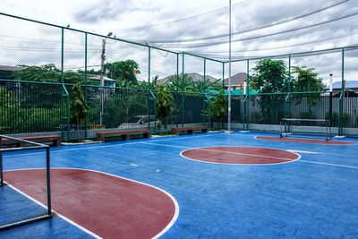 Empty basketball court against sky