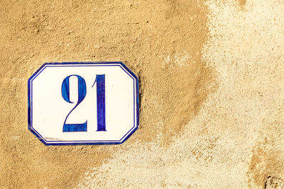 Close-up of number 21 on wall