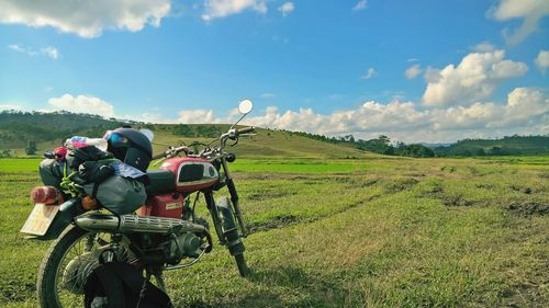 Tractor on field against sky