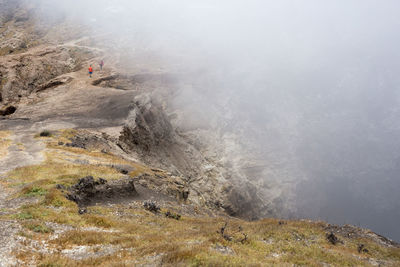 Scenic view of mountains in foggy weather