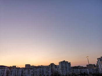 Buildings against sky during sunset