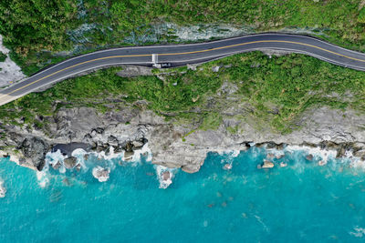 High angle view of rocks by sea