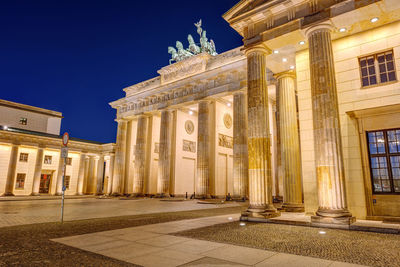 Lateral view of the illuminated brandenburger tor in berlin at night