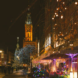 Low angle view of illuminated christmas tree at night