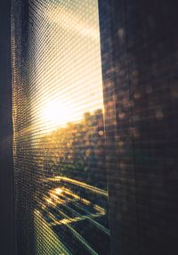 Sun shining through window in city