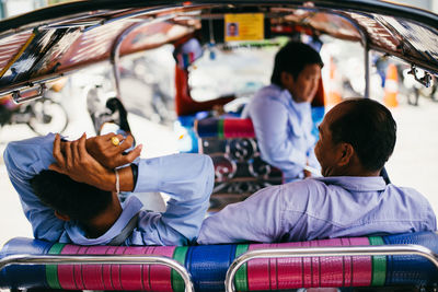 Men sitting in car