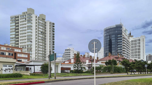 Buildings in city against sky