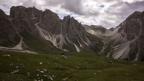 Scenic view of rocky dolomites mountains against sky