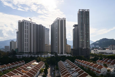 Modern buildings in city against sky