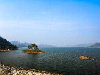 Scenic view of bay against sky