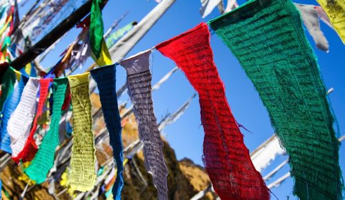 Low angle view of clothes drying against sky