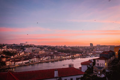 High angle view of buildings against sky during sunset in porto city, portugal 