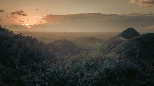 Scenic view of mountains against sky during sunset