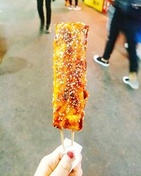 Close-up of hand holding ice cream cone