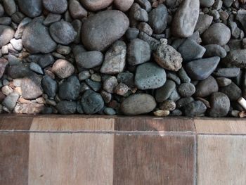 High angle view of pebbles on rocks