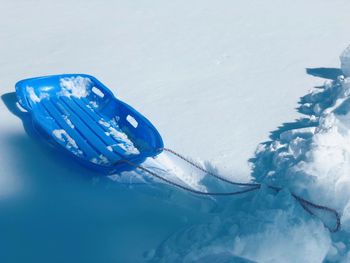 High angle view of snow on sea