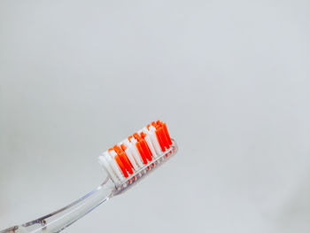 High angle view of red bell tower against white background