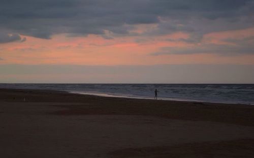 Scenic view of sea at sunset