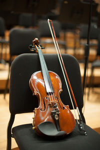 Violin on chair in auditorium