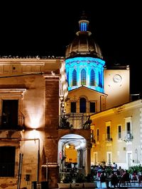 Illuminated buildings in city at night