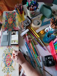 High angle view of woman hand on table